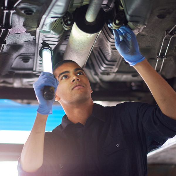 Mechanic checking exhaust in Millersville, MD